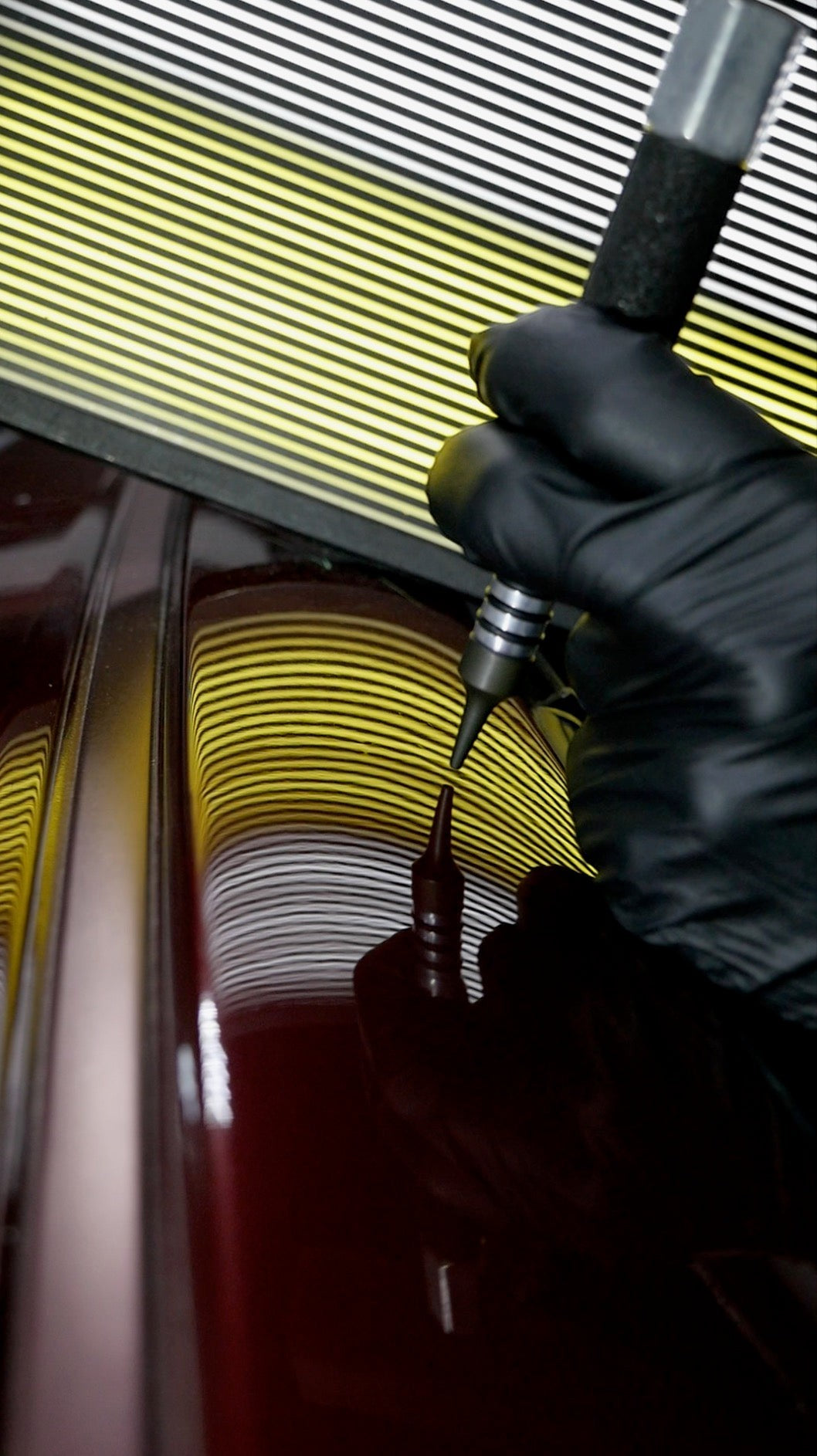 Anson PDR Dead Dent Tools Pee Wee ballistic knockdown tip being used to repair a sharp crown on a car panel