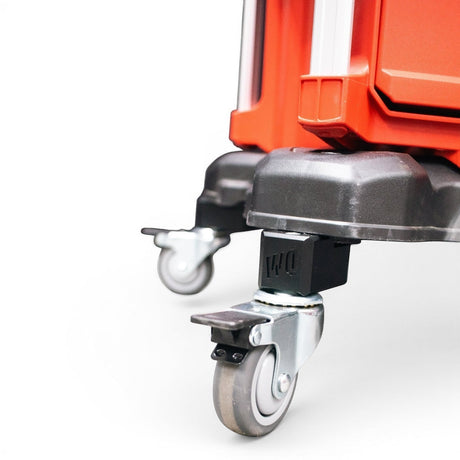 WQ Willey Quick Glideator caster upgrade kit with black mounting blocks and silver casters on an orange tool case.