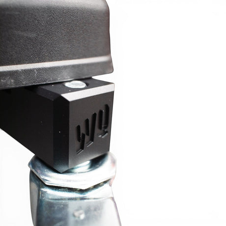 Willey Quick black aluminum caster mounting block with WQ logo for Milwaukee Packout system, showing improved stability.