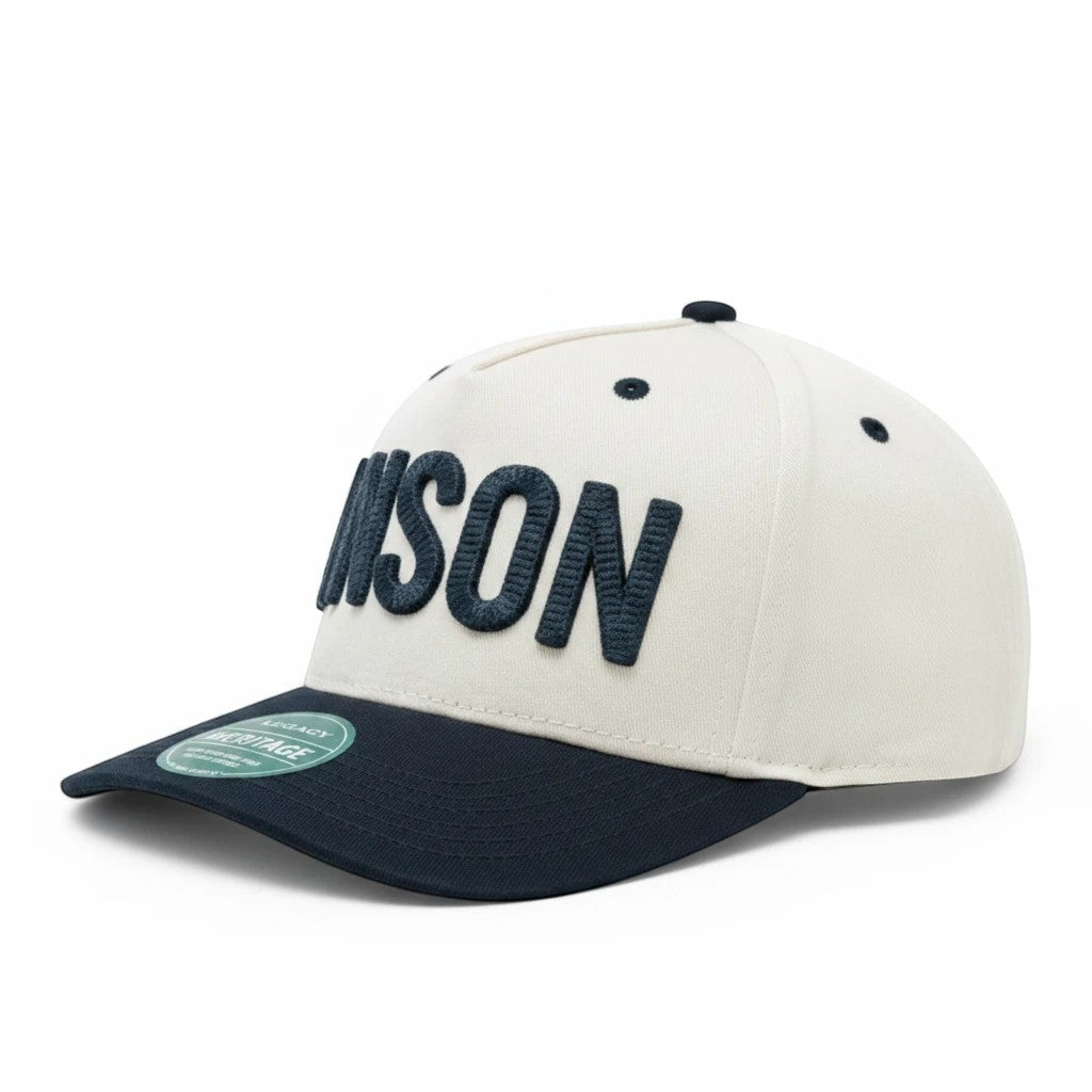 Anson PDR America 250th edition snapback hat in white with navy blue brim and bold embroidered lettering.