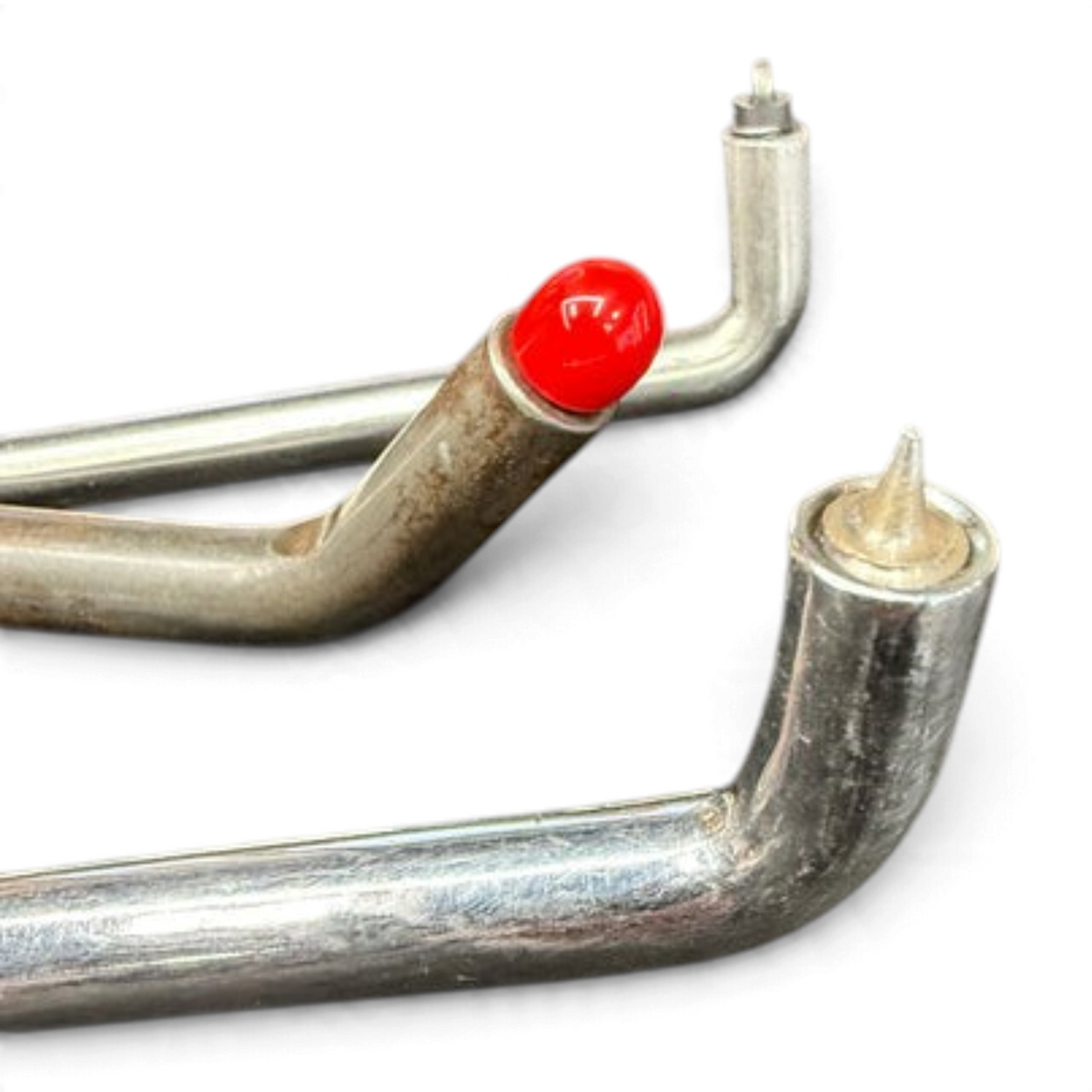 Anson PDR Black Plague micro tips attached to metal PDR tools, featuring a red cap and a sharp pointed tip.