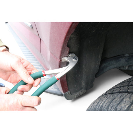 Anson PDR fender lip edge pliers with green anti-slip handles, made of stainless steel and ABS, used to remove a car fender clip.
