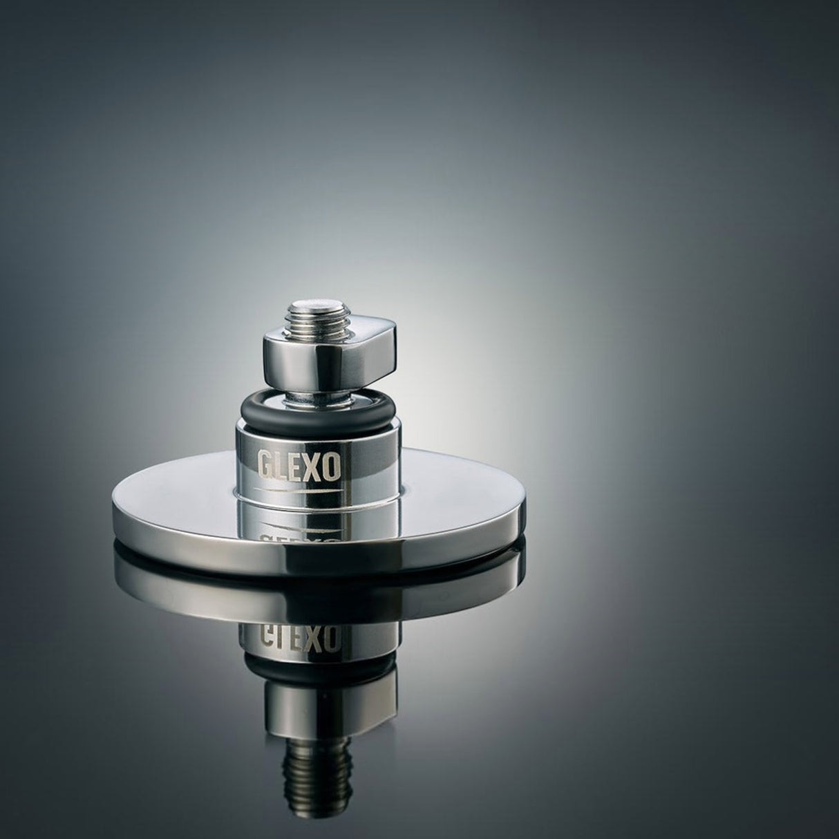 Anson PDR Glexo round metal PDR tab with O-ring and threaded stem for paintless dent repair on a reflective surface.