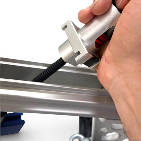 Anson PDR Mini Re-tension system with silver metal tensioner and black corrugated hose attached to aluminum extrusion.