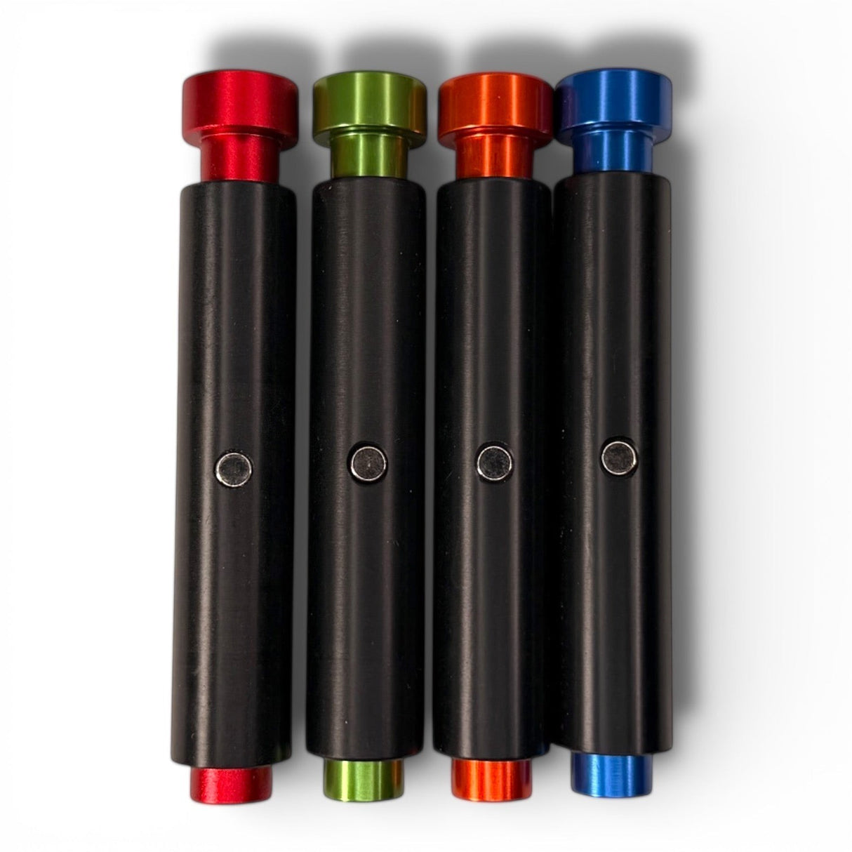 Anson PDR ShockBlocker X4 dent repair knockdowns in red, green, orange, and blue with black shafts and magnets.