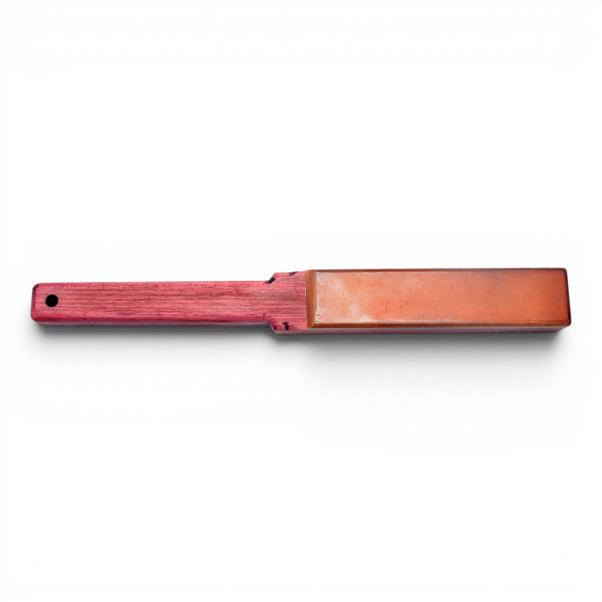 Anson PDR wood paddle with a leather striking surface. Red wood handle with a hole for hanging.