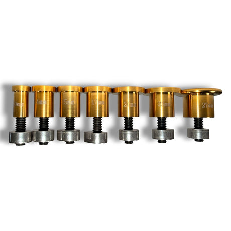 PDR Outlet black and gold stainless steel cold glue tabs for dent repair, shown in various sizes from 10mm to 27mm.