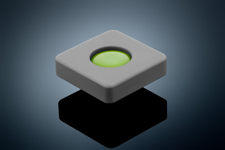 Anson PDR Glexo Diablo Cold Glue in a grey silicone mold with a bright green glue center, designed for paintless dent repair.