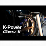 Keco K-Power Mini Gen 2 lateral tension tool on a black car door, used for hail damage repair.