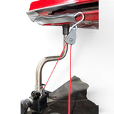 Anson PDR clamp-style rope ratchet with red cord attached to a car hood stand for dent repair.
