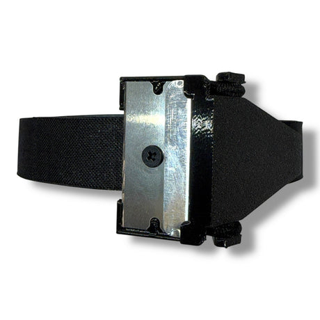 Anson PDR Tape Sniper cutter with a sharp metal blade and black elastic strap for secure handling.